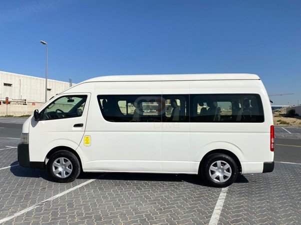 Hi-Roof 10-seater van for rent in Dubai, ideal for group travel, staff shuttles, and city tours