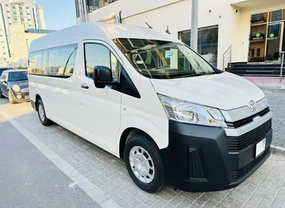 A 12-seater HiAce van available for rent in Dubai, perfect for families, small tour groups, and office staff transport.