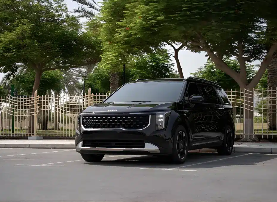 Kia Carnival 7 seater rental in Dubai with professional driver for family trips, airport transfers, and corporate travel