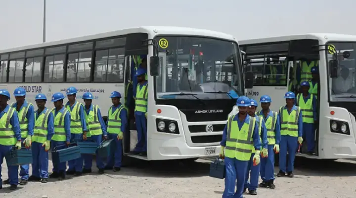 Bus rental service transporting labor workers to and from a job site safely and efficiently.