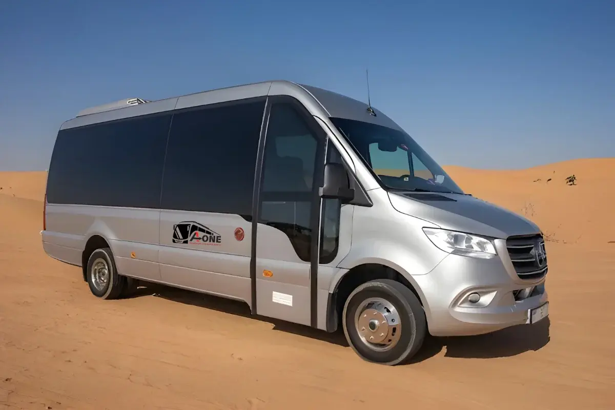 Tourists traveling from Dubai to Abu Dhabi for a city tour in a comfortable bus or van