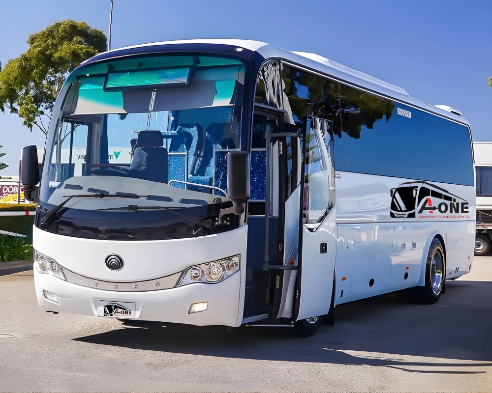 Tourists traveling for an Abu Dhabi desert tour in a comfortable van or mini bus across the UAE desert dunes