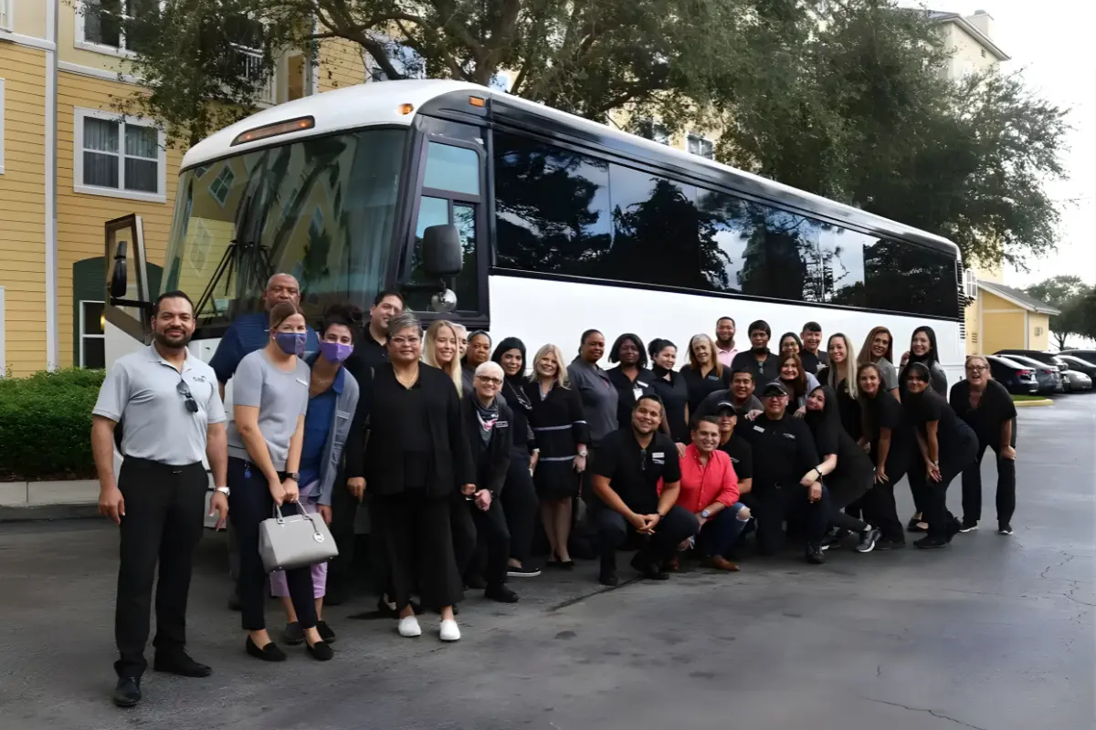 Mini bus transporting a group of tourists for city tours and sightseeing across Dubai and the UAE