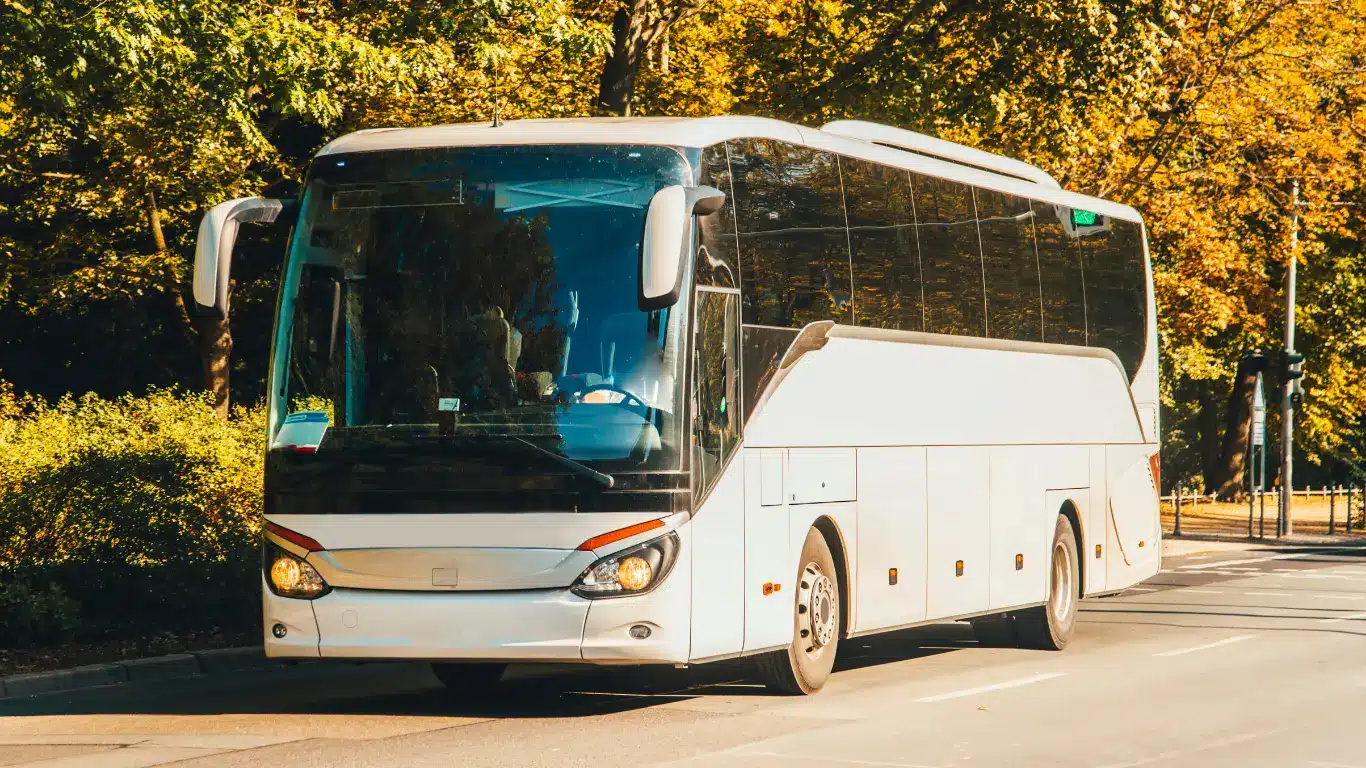 Tourists enjoying a convenient bus rental service in Dubai for sightseeing