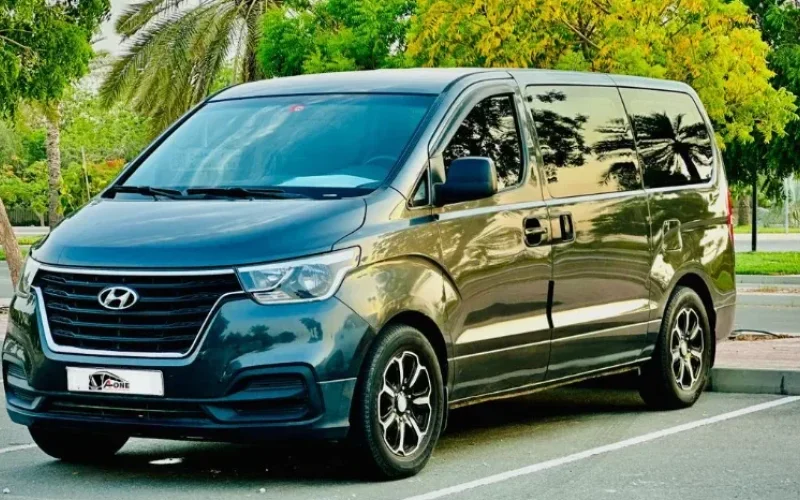 Tourists riding a hop-on hop-off bus during a Dubai sightseeing tour
